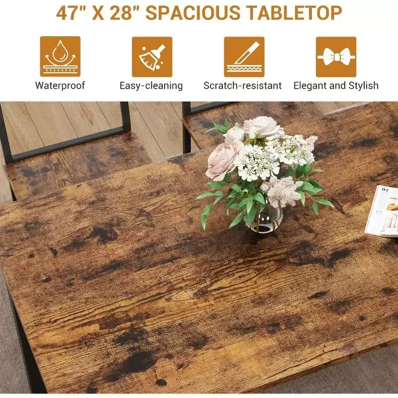 Une table à manger rectangulaire pour quatre, deux chaises et un banc