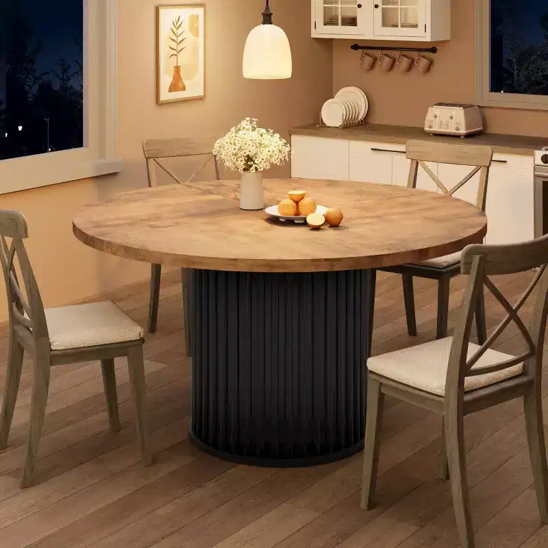 Table à manger ronde avec un piètement en métal ondulé